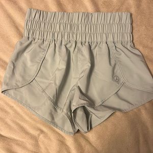 green “embrace your love” shorts